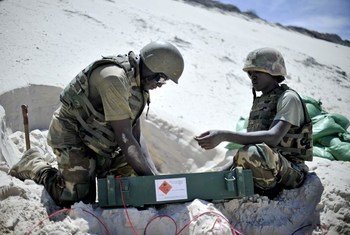 Members of the African Union Mission in Somalia (AMISOM), destroying munitions captured from al-Shabaab militants, at a safe location outside Mogadishu.