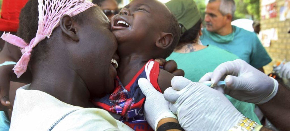 A child receiving a tetanus vaccination provided by the World Health Organization (WHO) at Delmas 33, an IDP camp in Port-au-Prince, Haiti.
