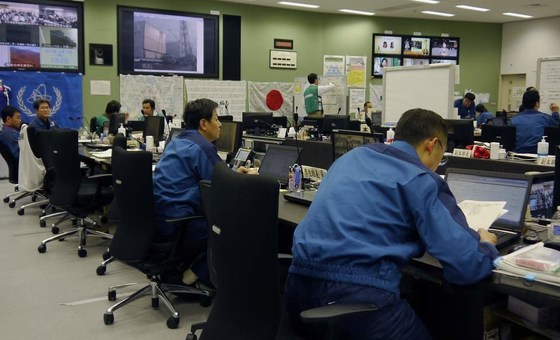 Workers monitor the Fukushima Daiichi Nuclear Power Plant from the Emergency Response Centre.