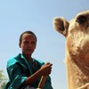 A young boy on a camel in Agadez, Niger.