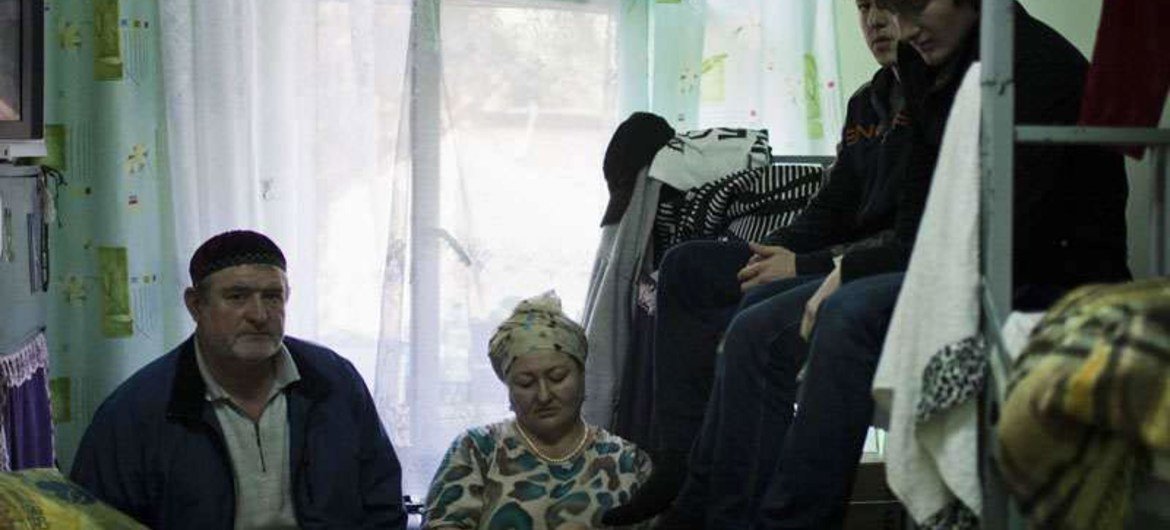 A homeless family from Chechnya at a reception centre in Linin, Poland.