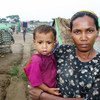 A Rohingya woman and her child at a makeshift camp outside Sittwe in Myanmar's western Rakhine State.