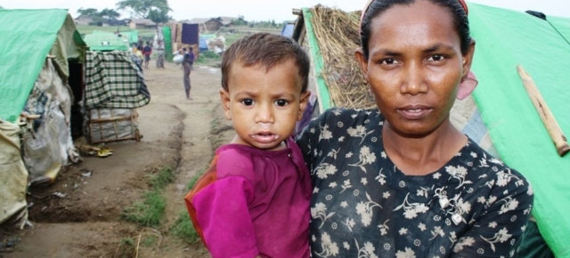A Rohingya woman and her child at a makeshift camp outside Sittwe in Myanmar's western Rakhine State.