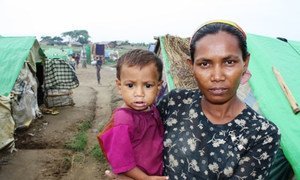 A Rohingya woman and her child at a makeshift camp outside Sittwe in Myanmar's western Rakhine State.