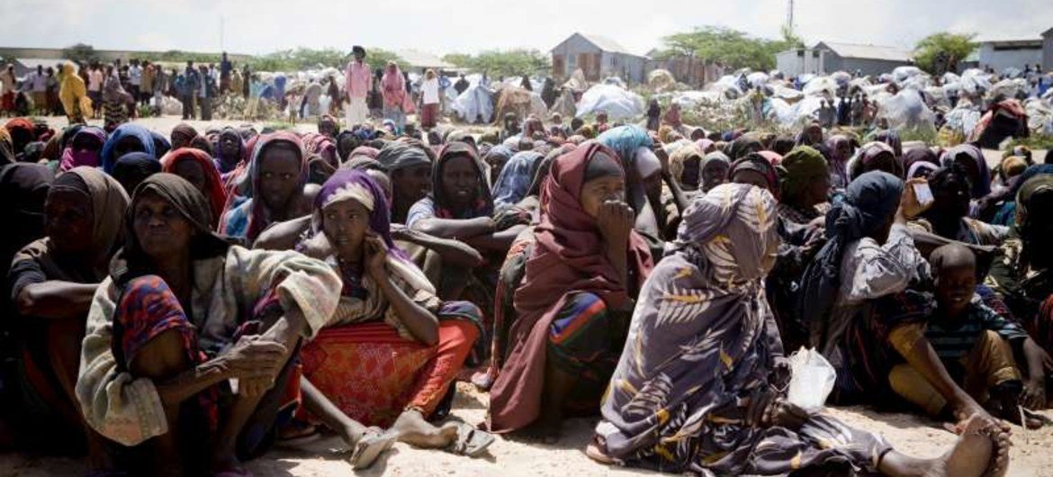 An archive photograph of Somali women waiting for UNHCR aid supplies at a settlement for the displaced in Mogadishu.