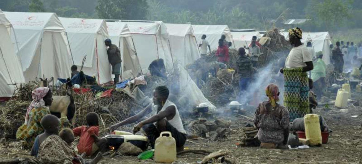 Refugees from the Democratic Republic of the Congo (DRC) prepare meals in the Bubukwanga transit centre in western Uganda.