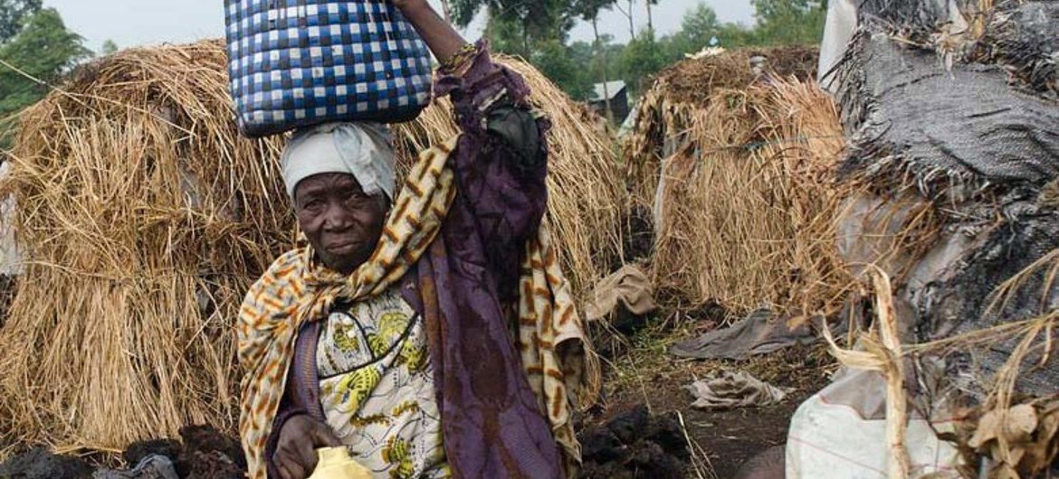 A woman walks through a camp for the displaced in eastern Democratic Republic of the Congo (DRC).