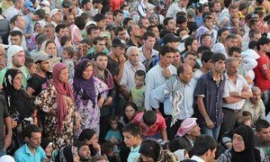 Syrians stream from their war-torn country into Iraq's Kurdistan region.