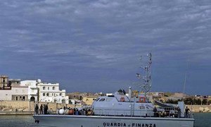 A customs boat enters a port in southern Italy after searching for boats carrying people hoping to reach Europe. More and more Syrians are taking sea routes to the continent.