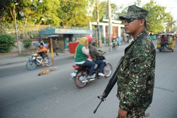 A member of the Armed Forces of the Philippines (AFP) at a checkpoint on the streets of Cotabato.