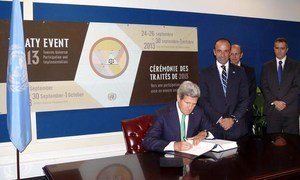 US Secretary of State John F. Kerry signing Arms Trade Treaty.