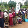 Consumers line up to buy scarce maize supplies at a market in Rumphi, northern Malawi.