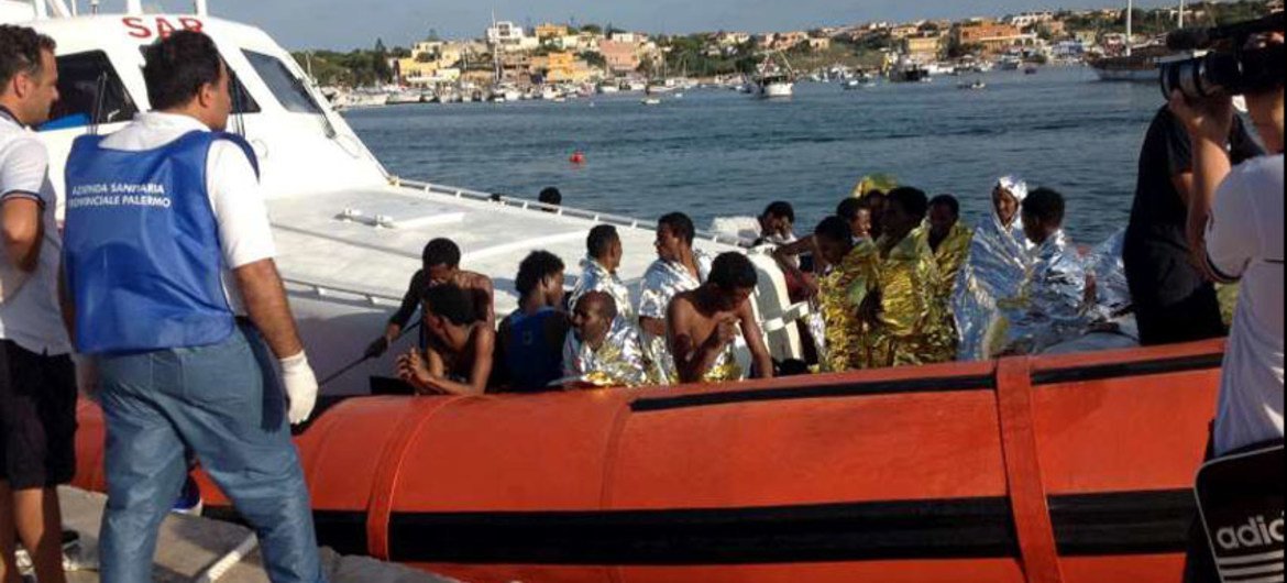 The Italian coastguard brings survivors of Thursday's tragedy to the harbour in Lampedusa. AMSA/UNHCR