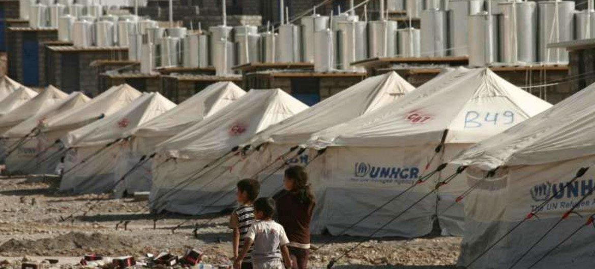 Three Syrian refugee children explore the new camp at Darashakran in northern Iraq.