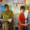 印度学校的教师和学生  教科文组织图片/GMR Akash