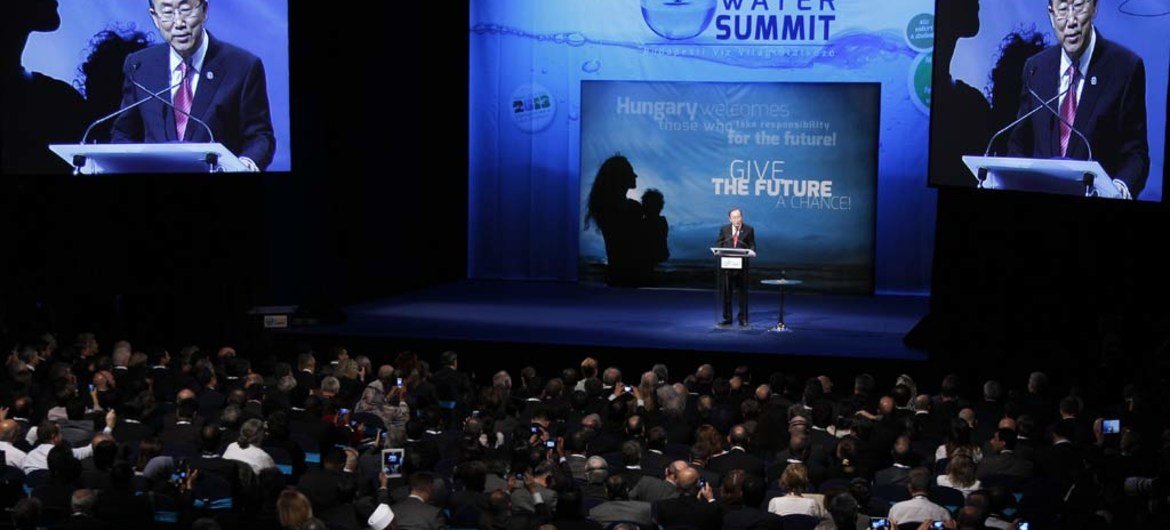 Secretary-General Ban Ki-moon (at lectern and on screens) addresses the 2013 Water Summit in Budapest, Hungary.