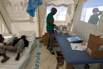 A nurse prepares re-hydration fluid for patients at a Cholera treatment center in Lester, a town 2 hours north of Port au Prince, Haiti. (2012)