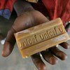 In the Central Africa Republic in 2008, a child holds out a bar of soap. UNICEF distributed soap as part of a national immunisation campaign.