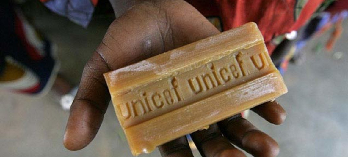 In the Central Africa Republic in 2008, a child holds out a bar of soap. UNICEF distributed soap as part of a national immunisation campaign.