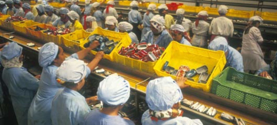 Workers in a food processing plant.