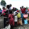 People lining up for food distribution in the Lac Vert IDP site near Goma, North Kivu, DRC.