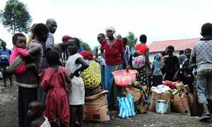 People lining up for food distribution in the Lac Vert IDP site near Goma, North Kivu, DRC.