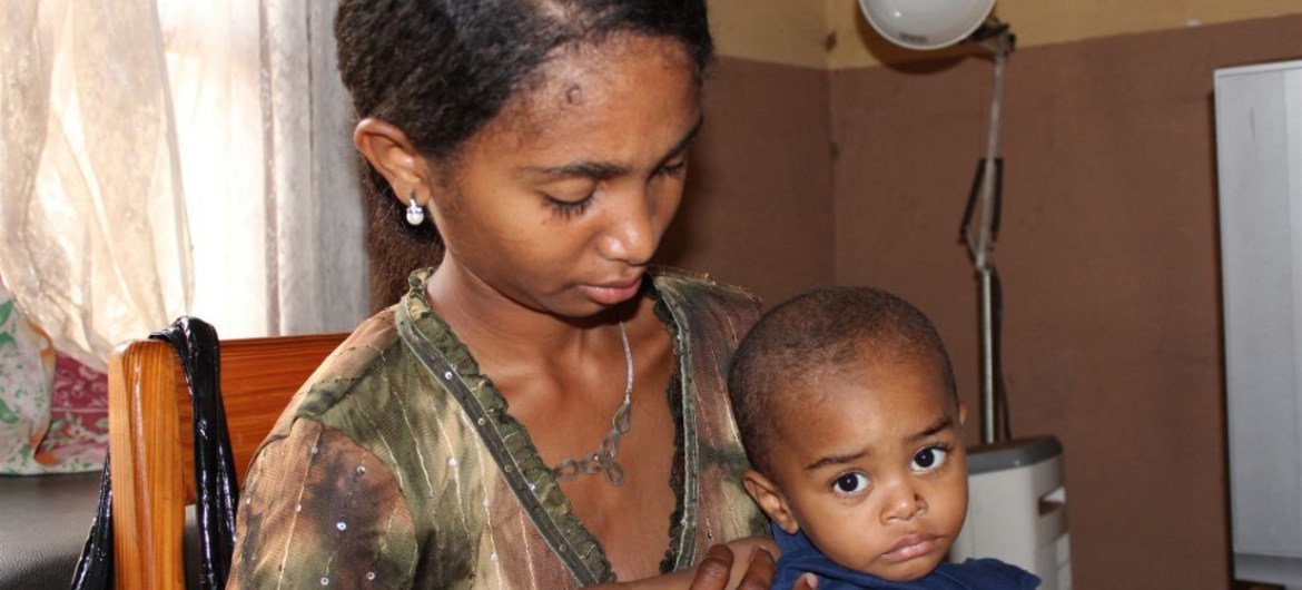 A mother at the Manakara clinic, in south eastern Madagascar, brings her child for pneumonia check-up.