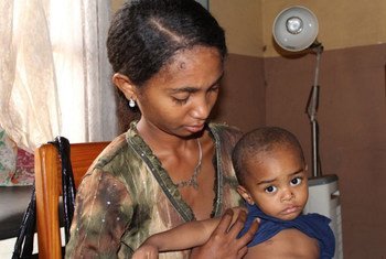 A mother at the Manakara clinic, in south eastern Madagascar, brings her child for pneumonia check-up.