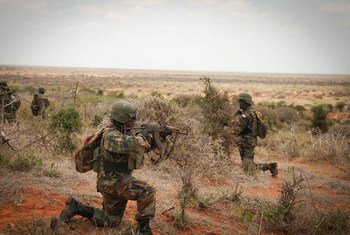 Sierra Leonean troops with AMISOM conduct a foot patrol near the city of Kismayo in southern Somalia.
