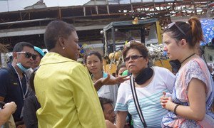 UN Emergency Relief Coordinator Valerie Amos (left) meeting with survivors of Super Typhoon Haiyan (local name Yolanda) in the battered Philippine city of Tacloban.