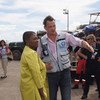Humanitarian Chief Valerie Amos  (left) meets with a member of the UN Disaster Assessment and Coordination team in Tacloban, the Philippines.