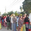 Nepalese wait at a polling centre to vote in the 19 November 2013 elections for members of the Constituent Assembly.