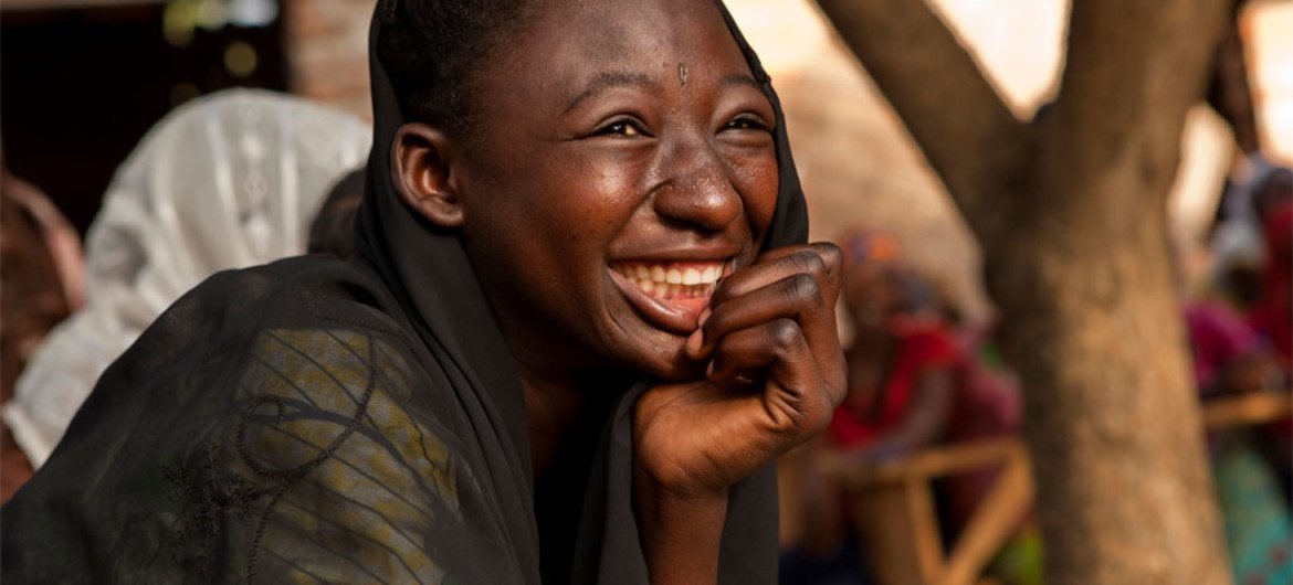 A girl laughs during a skit on the prevention of HIV, at a youth centre in Moundou, Chad.