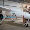 Head of Peacekeeping Operations Herve Ladsous (second right), inspects an Unmanned/Unarmed Aerial Vehicle (UAV) that will be used in eastern Democratic Republic of the Congo, during a ceremony in Goma.