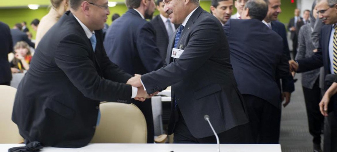 Foreign Minister Nasser Judeh of Jordan (right), is congratulated after his country was elected by the General Assembly as a non-permanent member of the Security Council.