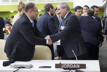 Foreign Minister Nasser Judeh of Jordan (right), is congratulated after his country was elected by the General Assembly as a non-permanent member of the Security Council.