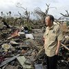 Visiting Tacloban, Philippines, UN Secretary-General Ban Ki-moon surveys damage left by Typhoon Haiyan.