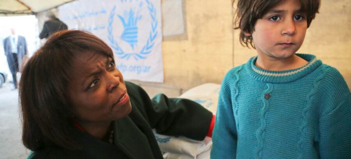 WFP Executive Director Ertharin Cousin visits with families in Syria. Millions have fled their homes, creating a humanitarian crisis in which food is a top priority.