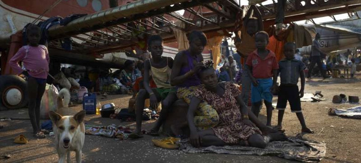 Displaced civilians of Bangui take shelter in the shell of an aircraft at the city's airport.