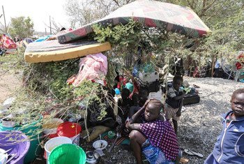 Displaced civilians with some of their only possessions take refuge at UN House.