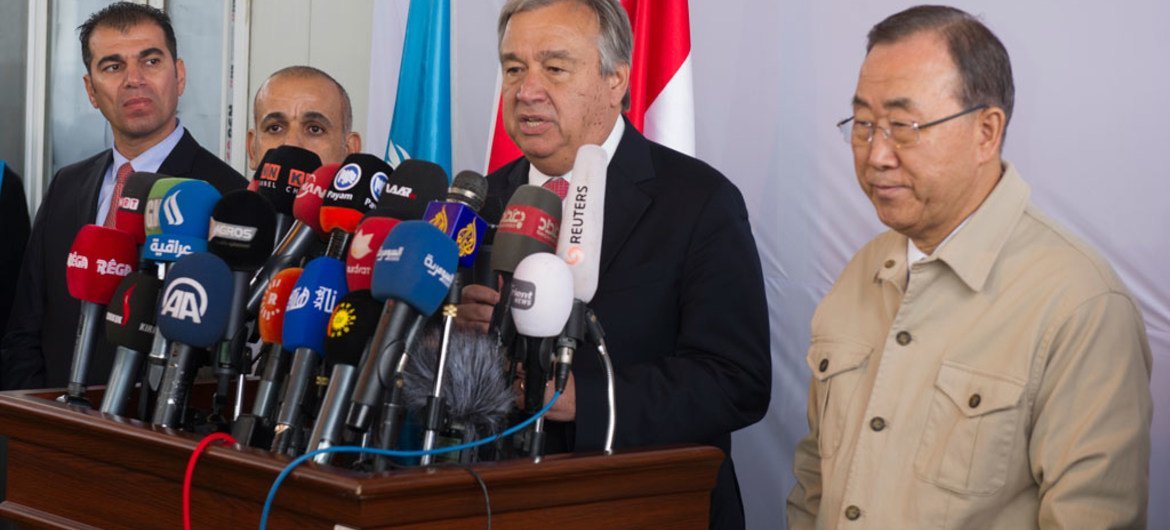 Secretary-General Ban Ki-moon (right) joins High Commissioner for Refugees António Guterres as he briefs the media during a joint press conference at the Kawrgosik Refugee Camp, Iraq.