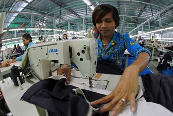 A garment industry worker sews garter to a skirt in Phnom Penh, Cambodia.