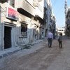 WFP staff in deserted streets of Baba Amer, Homs, Syria in June 2013.