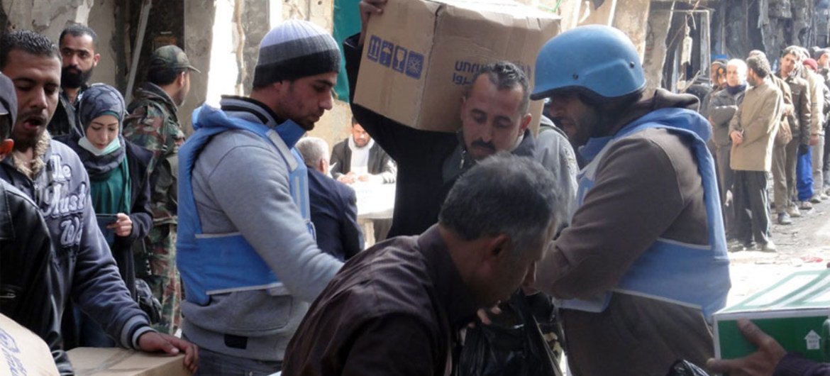 UNRWA distributing humanitarian aid at Yarmouk camp, Damascus, Syria, on 7 February 2014.