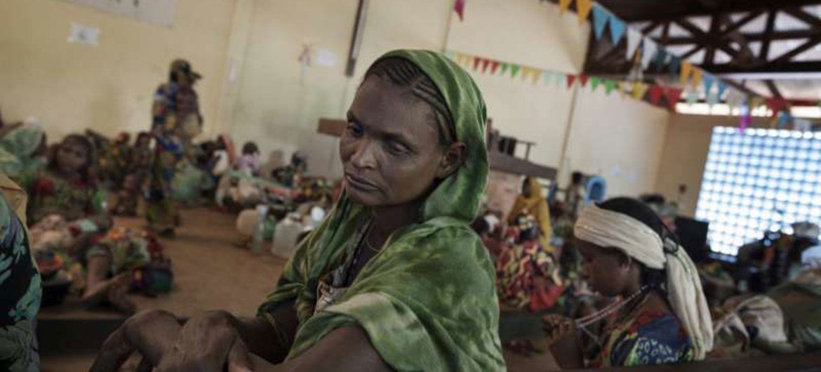 A displaced Central African Republic (CAR) woman ponders her situation in the shelter of a church in Boali, a town north of the capital Bangui.