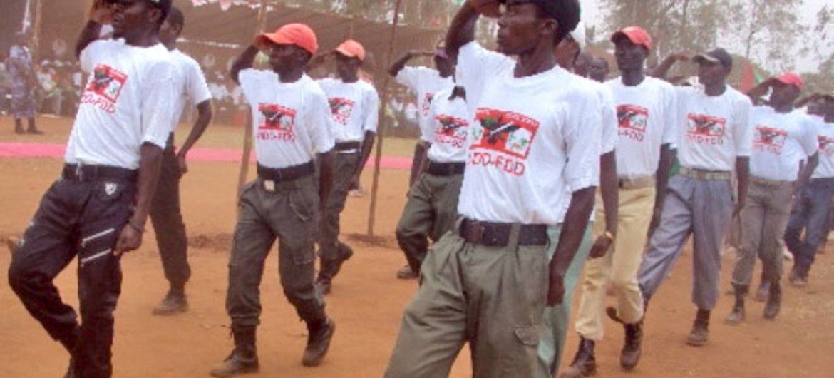 Members of Burundi’s ruling party youth wing march at a rally in September 2012.