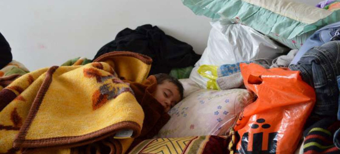 This infant was caught having a nap in Al Qaim in western Anbar, Iraq. He fled there with his mother and siblings to escape the violence in Anbar, which is entering a third month.