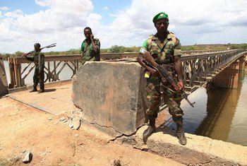 African Union troops guard a bridge over the Juba river near the town of Burdubow which they regained control of from Al Shabaab insurgents on 9 March 2014 during a joint operation with Somali National Army troops.