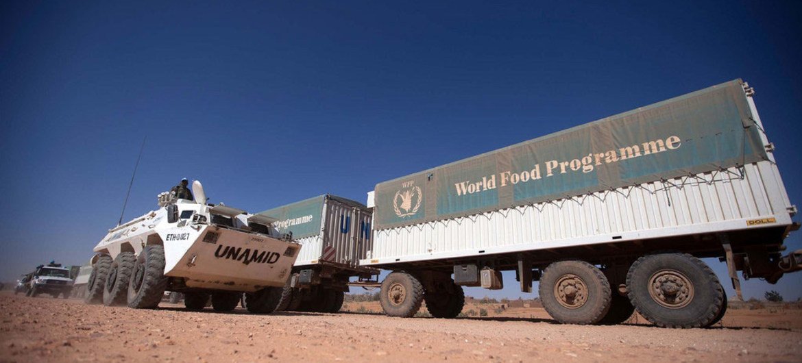 UNAMID troops escort World Food Programme (WFP) trucks during a trip from El Fasher to Shangil Tobaya, North Darfur on 10 February 2014.