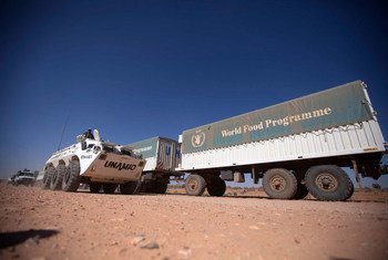 UNAMID troops escort World Food Programme (WFP) trucks during a trip from El Fasher to Shangil Tobaya, North Darfur on 10 February 2014.